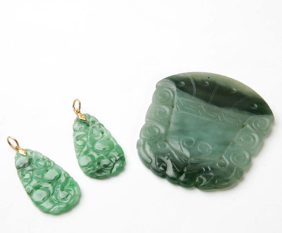 A pair of jade pendants and a nephrite panel (3)