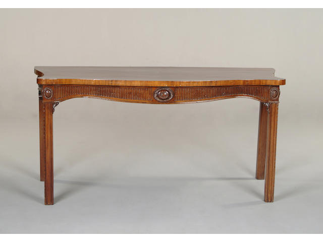 A George III style mahogany serpentine serving table