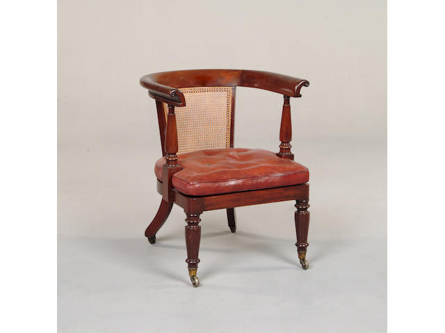 An early Victorian mahogany tub shaped library chair,