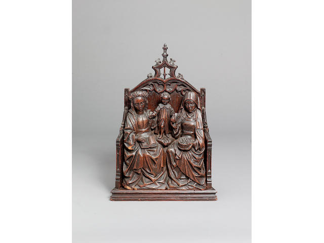 A late 15th or early 16th century oak carving of the Virgin and Christ child with Saint Anne