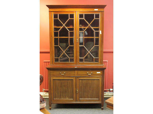 An Edwardian mahogany and crossbanded Bookcase Cabinet,