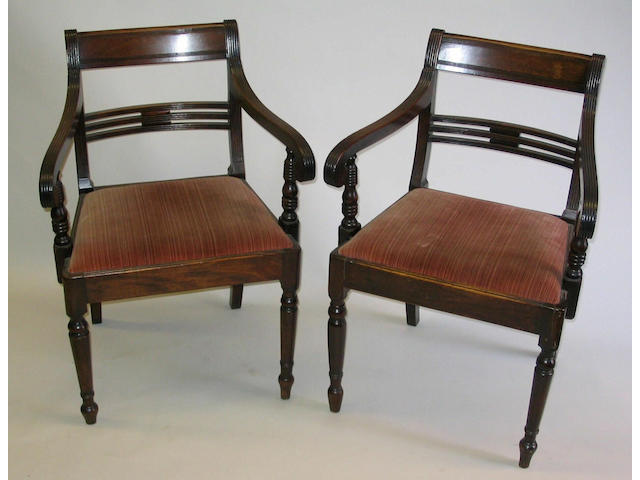 A pair of George IV mahogany elbow chairs,