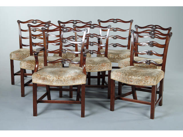 A set of eight Chippendale style mahogany ladderback dining chairs