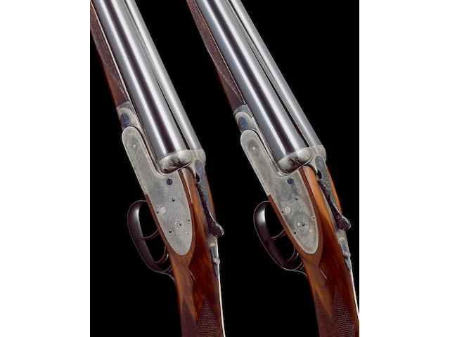 A pair of lightweight 12-bore (2&#190;in) self-opening sidelock ejector guns by J. Purdey, no. 24505/25310 In a leather motor-case