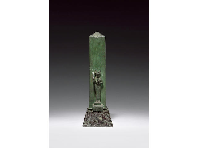 An Egyptian bronze statuette of Bastet with obelisk