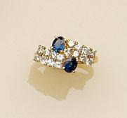 A diamond and sapphire crossover ring,