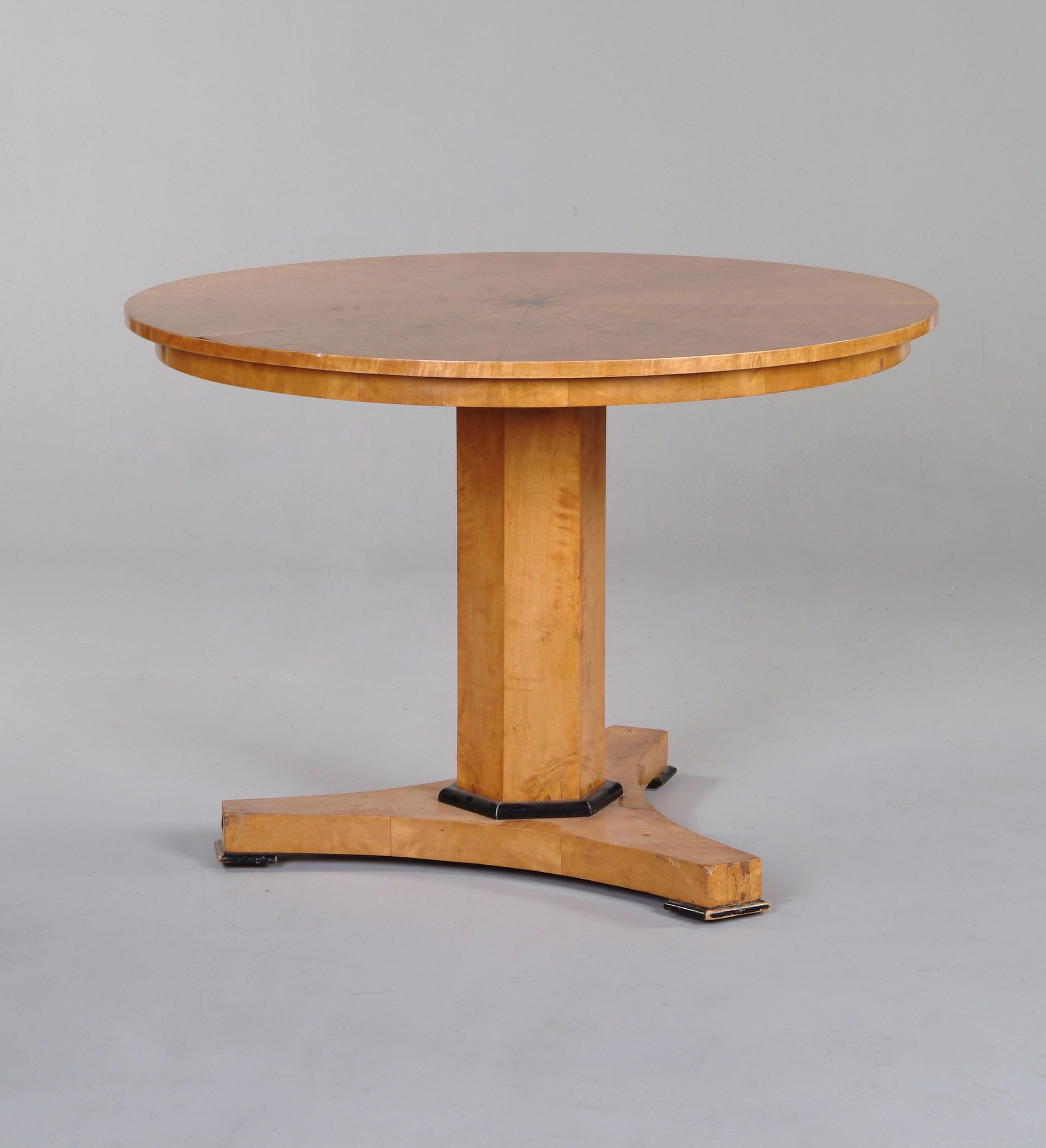 A Biedermeier satinbirch circular centre table
