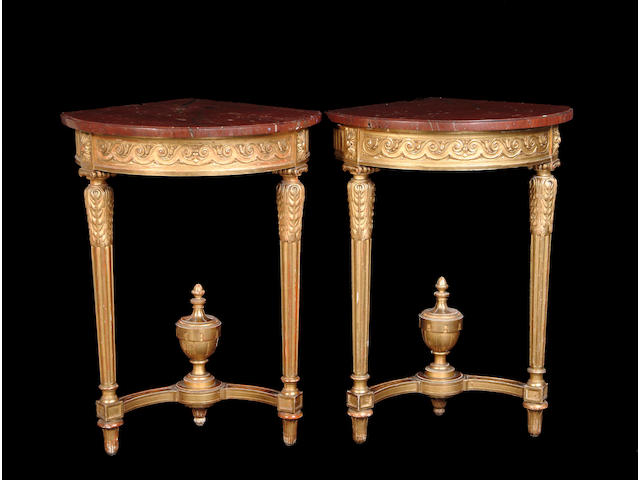 A pair of Louis XVI style console tables