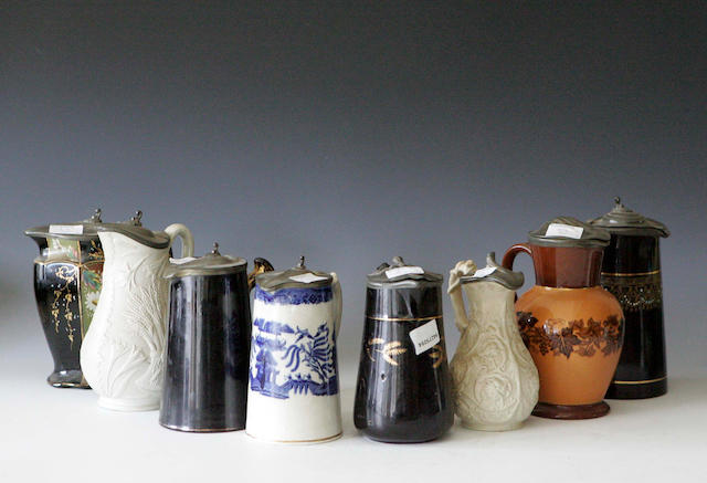 A group of eight pewter lidded Jugs,