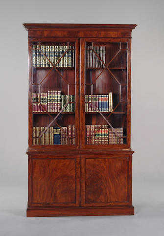 A George III style mahogany cabinet bookcase.