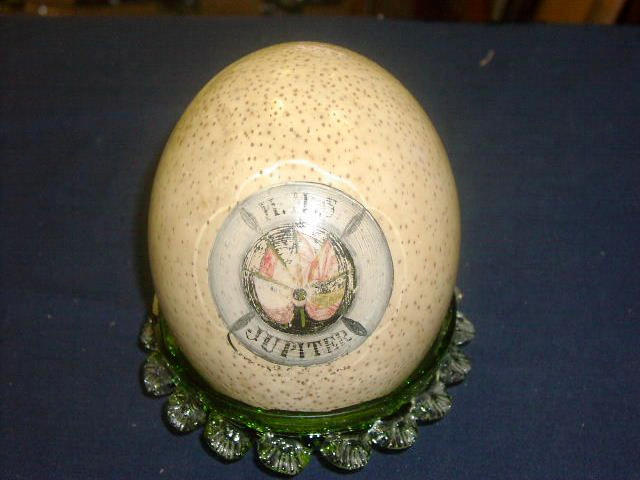 A decorated ostrich egg, 12cm diameter.