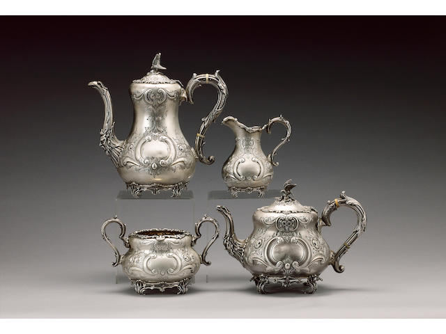 A matching four piece Irish silver tea and coffee service, the teapot by E. Johnson, Dublin 1924, the coffee pot, sugar bowl  and milk jug, maker's mark H& H, Dublin 1919 -24,
