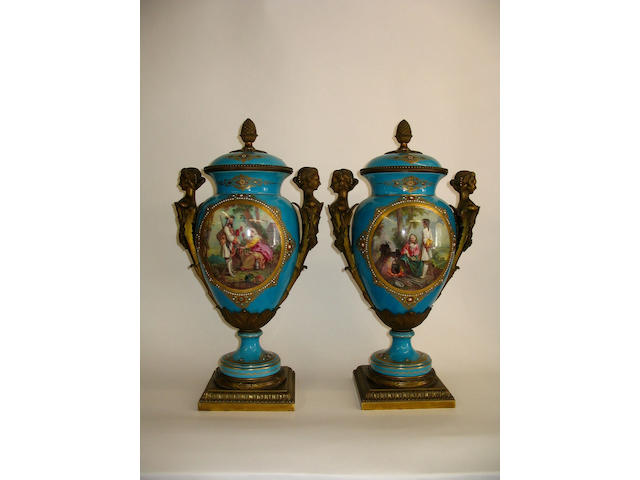 An impressive pair of Sevres style vases and covers