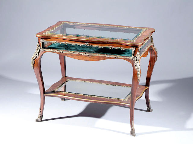 A Louis XV style Kingwood and gilt metal mounted bijouterie table On cabriole legs united by undertier, 90cm wide.