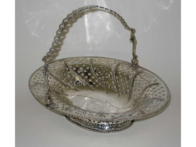 A George III swing handled cake basket By William Plummer, 1760,