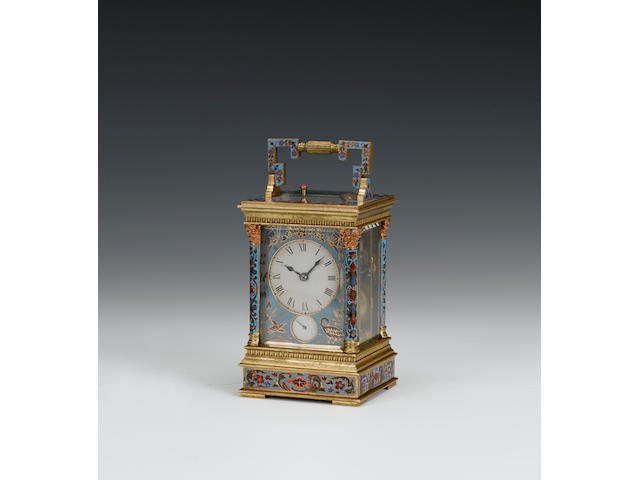 A late 19th century petite sonnerie striking carriage alarm clock with champleve enamel decorated case