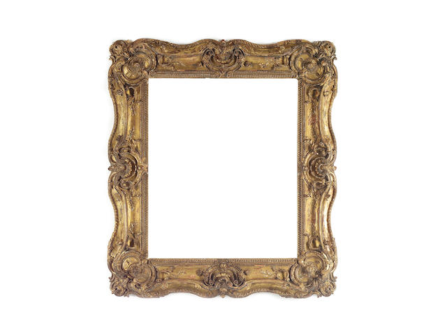 A French 19th Century carved, pierced, double-swept and gilded frame,