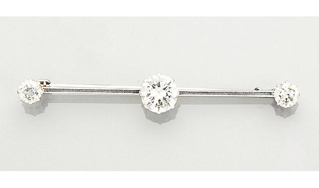 An early 20th century diamond three-stone bar brooch