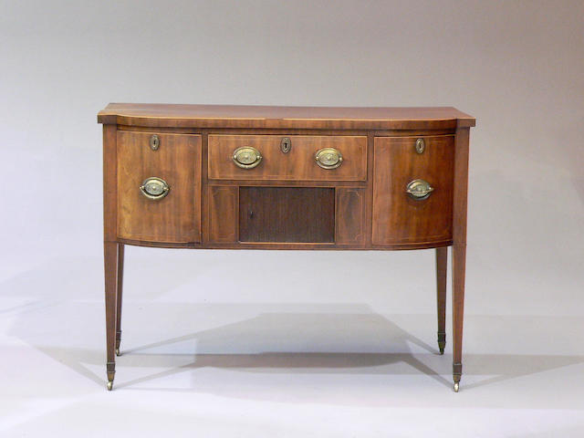 A George III mahogany and boxwood strung bowfront sideboard
