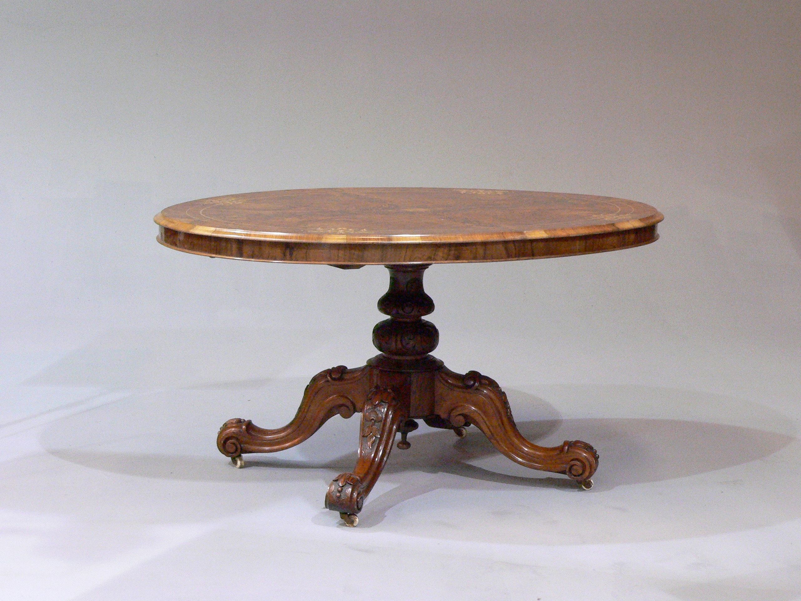 A Victorian walnut breakfast table
