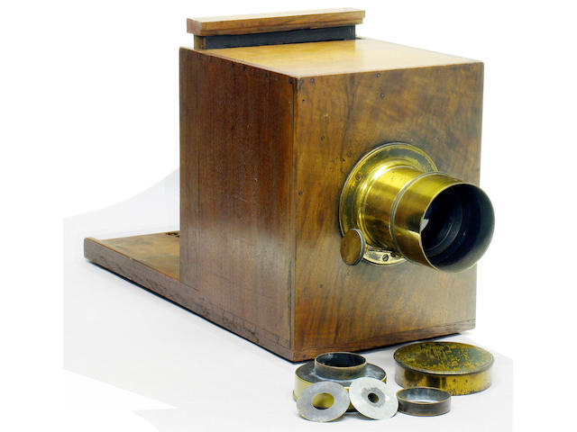 Sliding Box Wet Plate or Daguerreotype camera Early French, dovetailed, walnut and brass 5 x 7 inch 13 x 18cm.)  camera. Focusing screen 6 3/4 x 6 3/4" (17 x 17cm.).  Typical raised running strips on the  inner box corners.  Petzval type  lens signed 'VALLANTIN Optn. Fabnt.' with rack fine focusing, washer stops (2) focusing screen and brass cap.