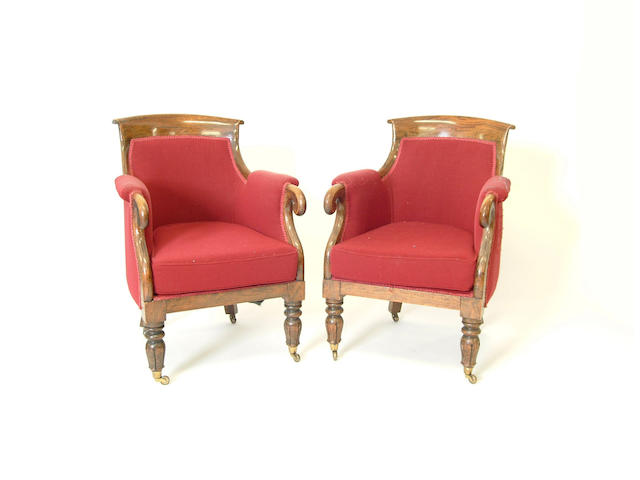 A pair of William IV simulated rosewood bergere armchairs