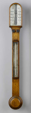 A late 19th century oak stick barometer Carpenter & Westley, 24 Regent St. London