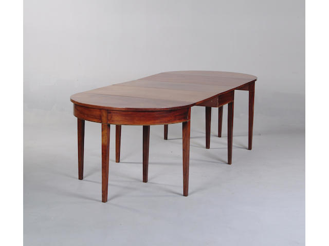 A George III mahogany extending dining table