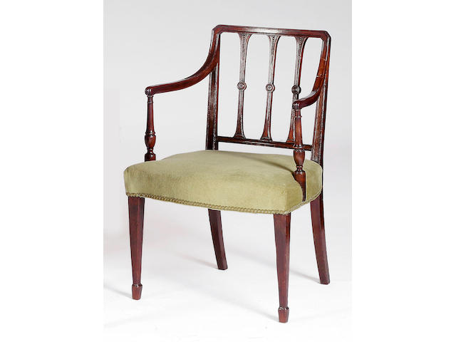 A set of seven 19th Century Sheraton-style mahogany dining chairs,