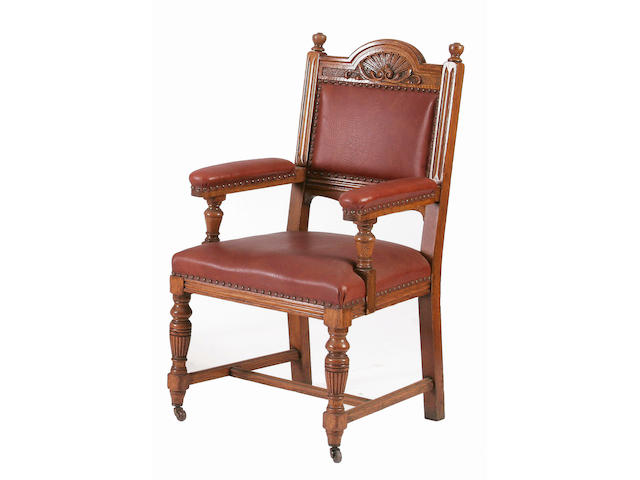 A set of twenty-five (24 + 1 arm) late Victorian/Edwardian oak dining/boardroom chairs