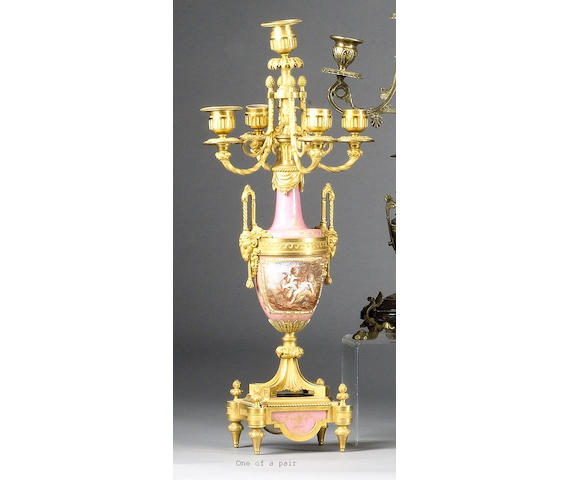 A pair of gilt metal and porcelain five light candelabra