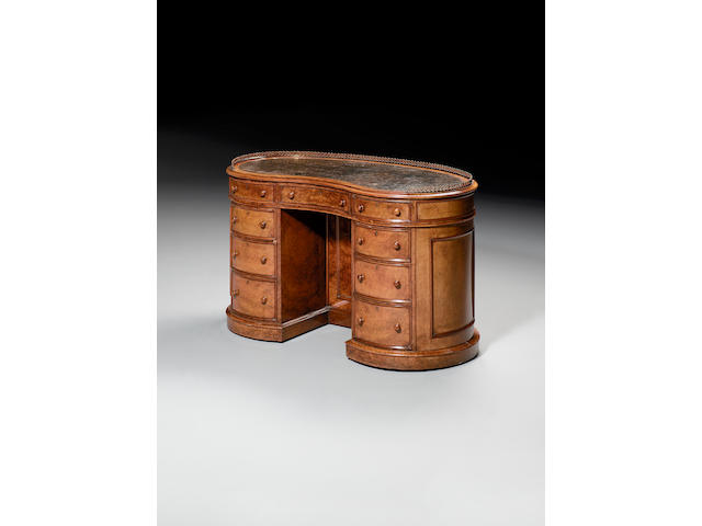 An early Victorian burr walnut kidney-shaped library desk, in the manner of Gillow