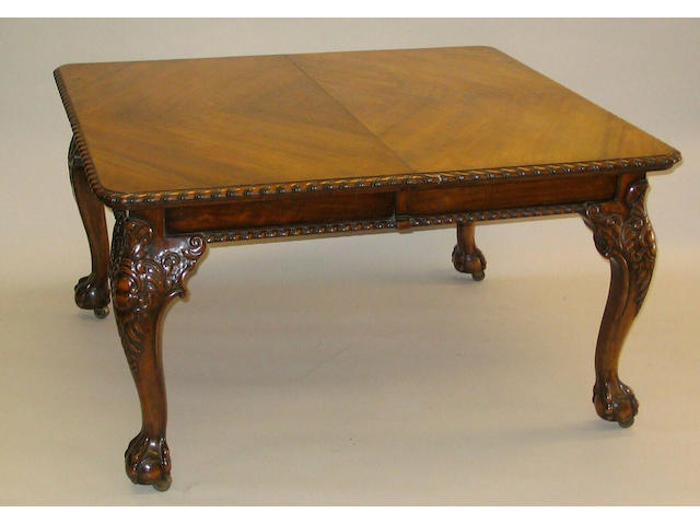 A Chippendale revival walnut extending dining table,