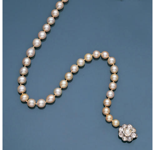 An Edwardian natural pearl necklace with diamond clasp