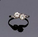 A diamond two stone crossover ring,