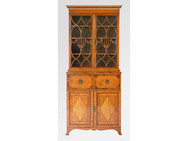 A satinwood and kingwood cross-banded George III style Sheraton revival secretaire bookcase,