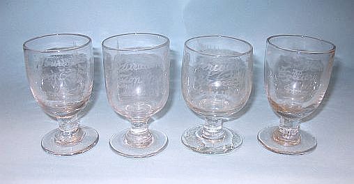 Four drinking glasses