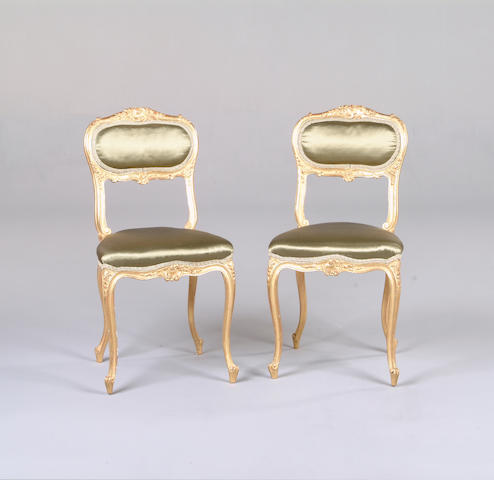 A pair of Louis XV style gilt boudoir chairs