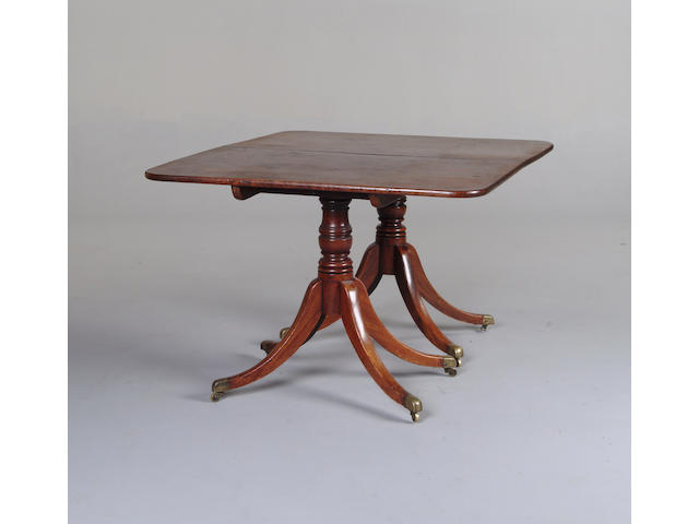 A Regency mahogany twin pedestal dining table
