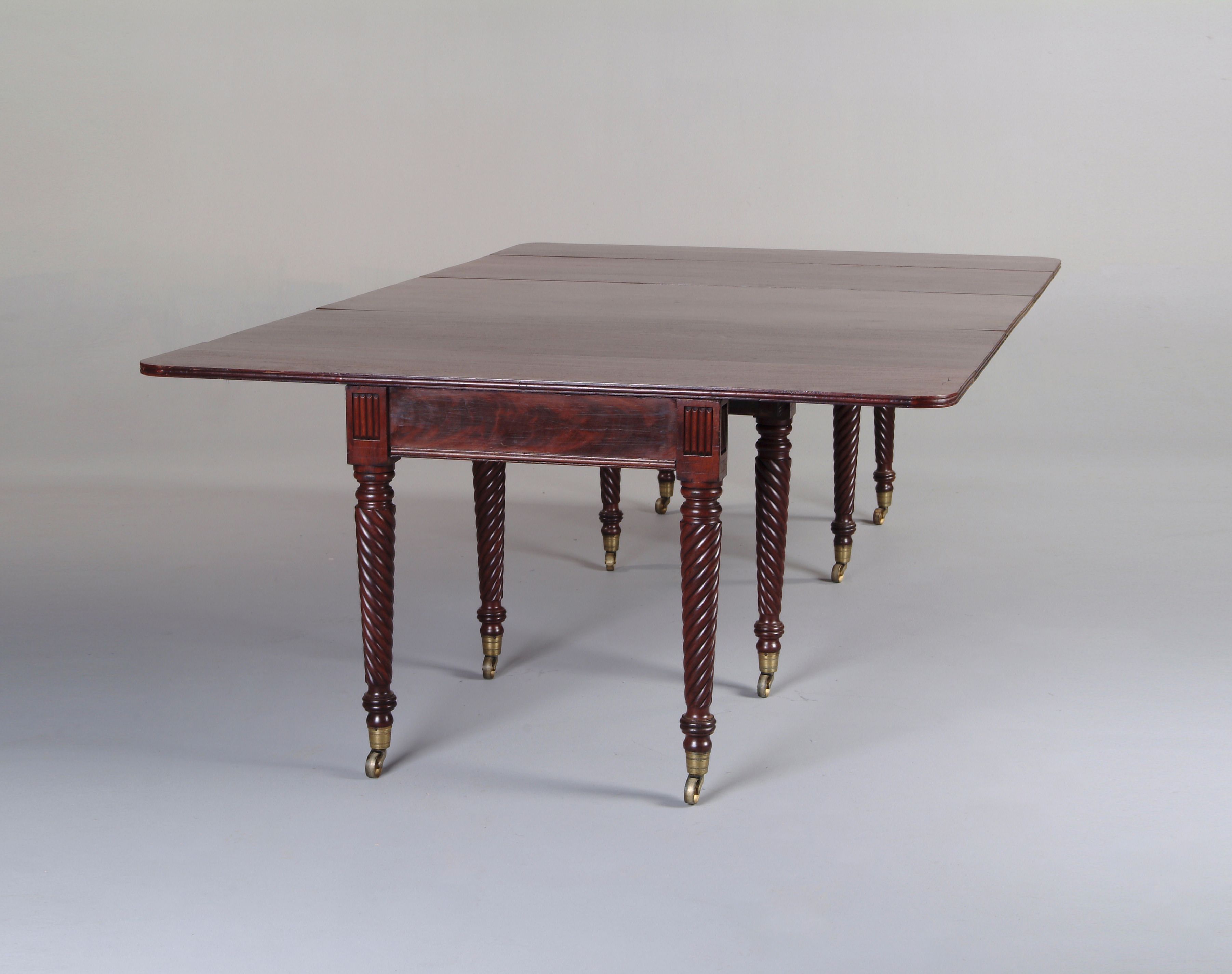 A Regency mahogany extending dining table