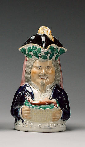 A 'Merry Christmas' Toby Jug and cover, circa 1860, probably Sampson Smith,