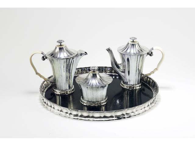 Josef Hoffmann for Wiener Werkst&#228;tte A Silver and Ivory Three Piece Tea Set and Matching Tray, circa 1922