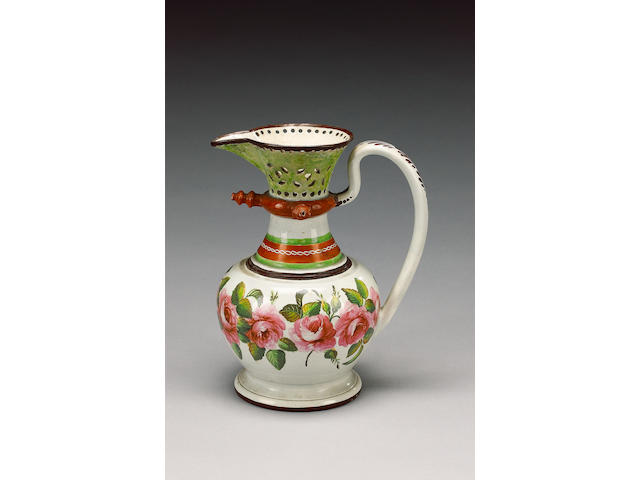 An enamelled pearlware puzzle jug, circa 1820,