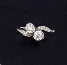 A two stone diamond crossover ring