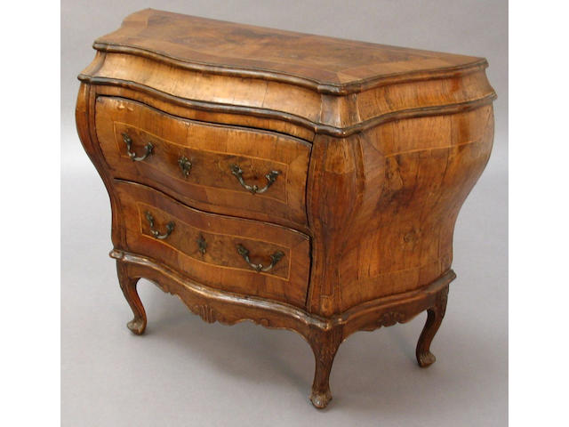 A small late 18th century Italian figured walnut, line inlaid and crossbanded commode