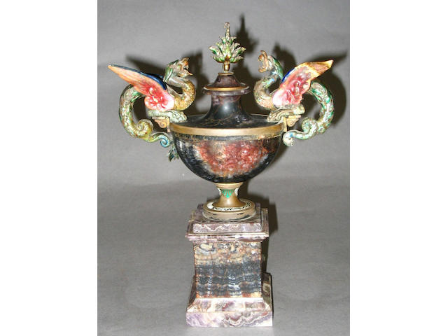An early 20th century felspar vase of boat shaped and lidded form