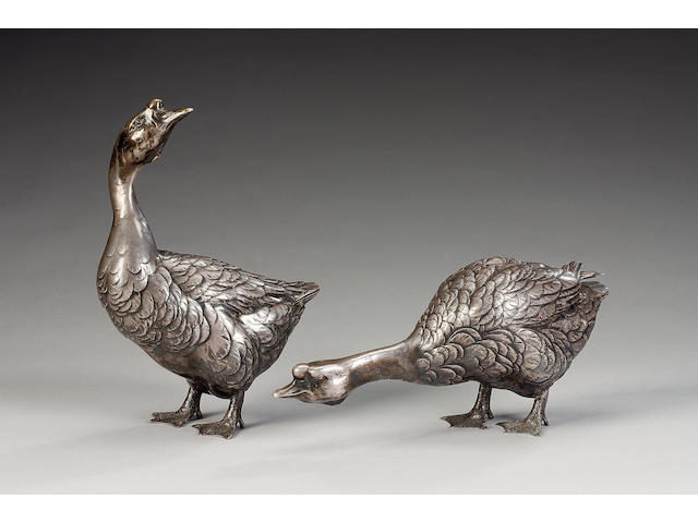 An elegant pair of white metal geese;