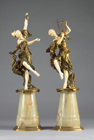 Rene Paul Marquet (French, b. 1875): A pair of gilt bronze chryselephantine figures of dancing classical female musicians