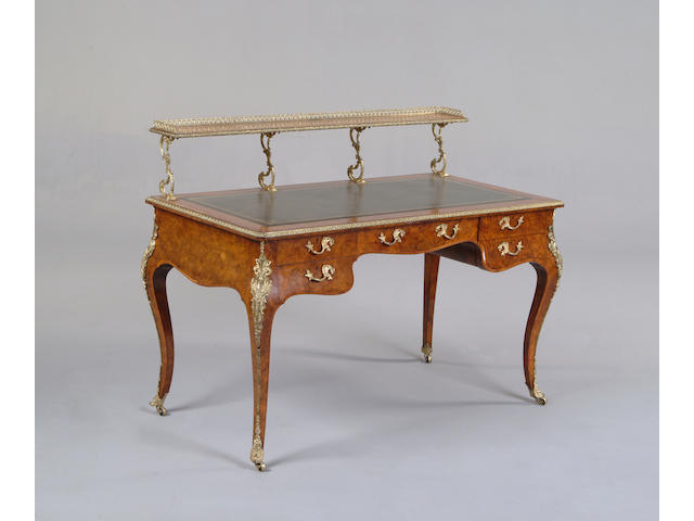A Victorian burr walnut, kingwood banded and gilt metal mounted writing table by Howard & Sons, Berner St.
