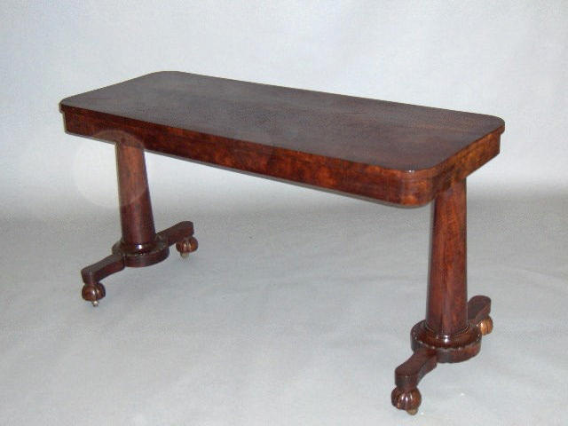 An Early Victorian mahogany crossbanded centre table,